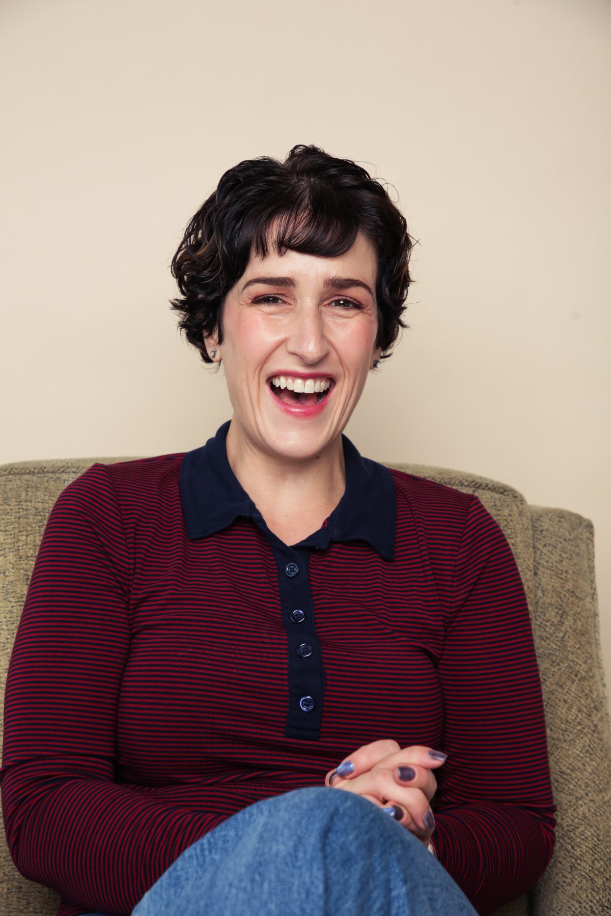 Ashley England laughing in conversation